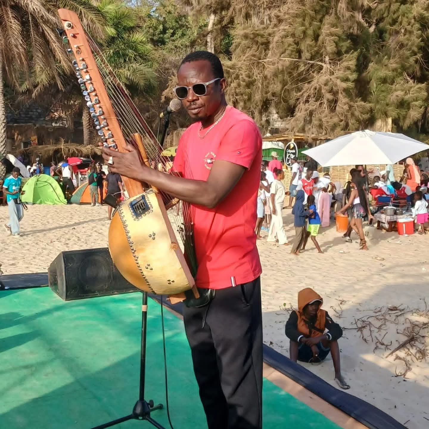 Kora player on the beach